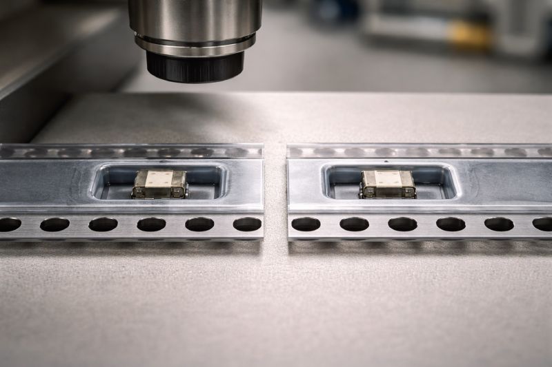 Comparison of embossed carrier tape pocket geometry showing stable component positioning versus slight lateral clearance under high-speed SMT conditions.