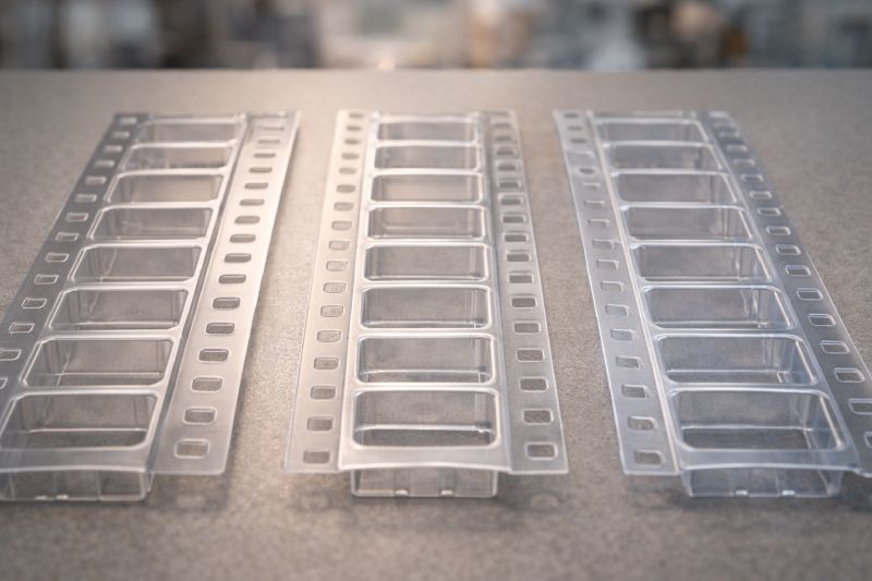 Comparison of embossed carrier tape materials PC PS and PET used in SMT packaging